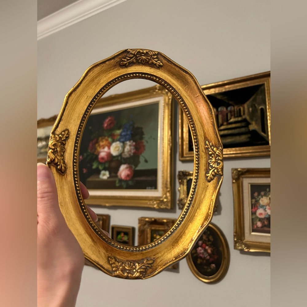 Gilded ornate oval frame